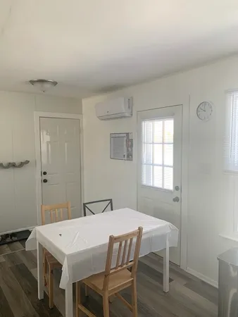 a dining room with a table and chairs