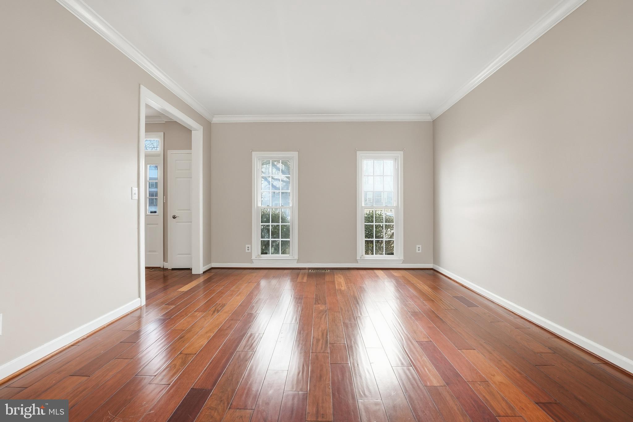 3582 Lions Field Road Triangle, VA 22172 - Photo 16 of 66 an empty room with wooden floor and windows