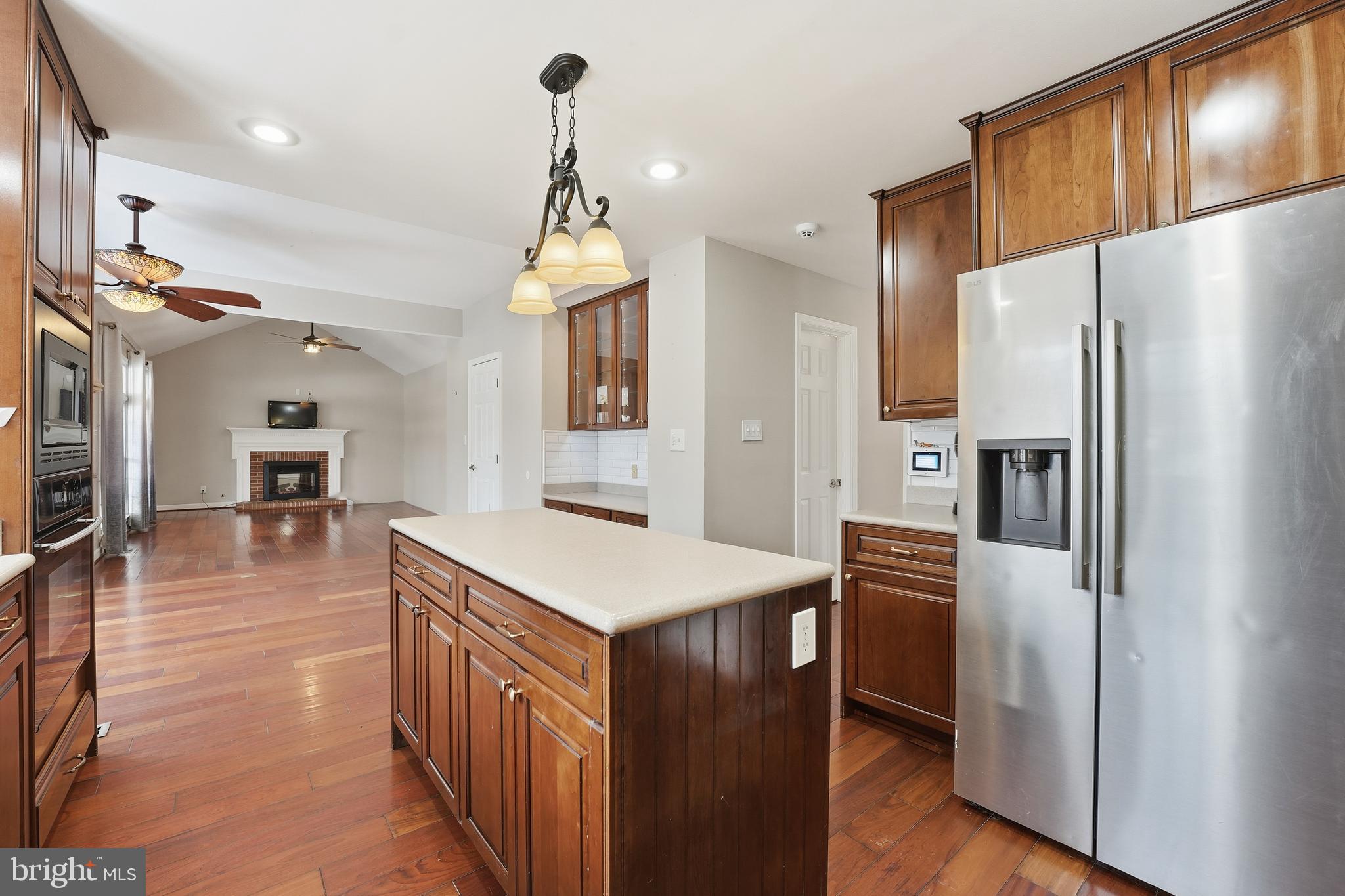 3582 Lions Field Road Triangle, VA 22172 - Photo 19 of 66 a kitchen with stainless steel appliances a refrigerator and a stove