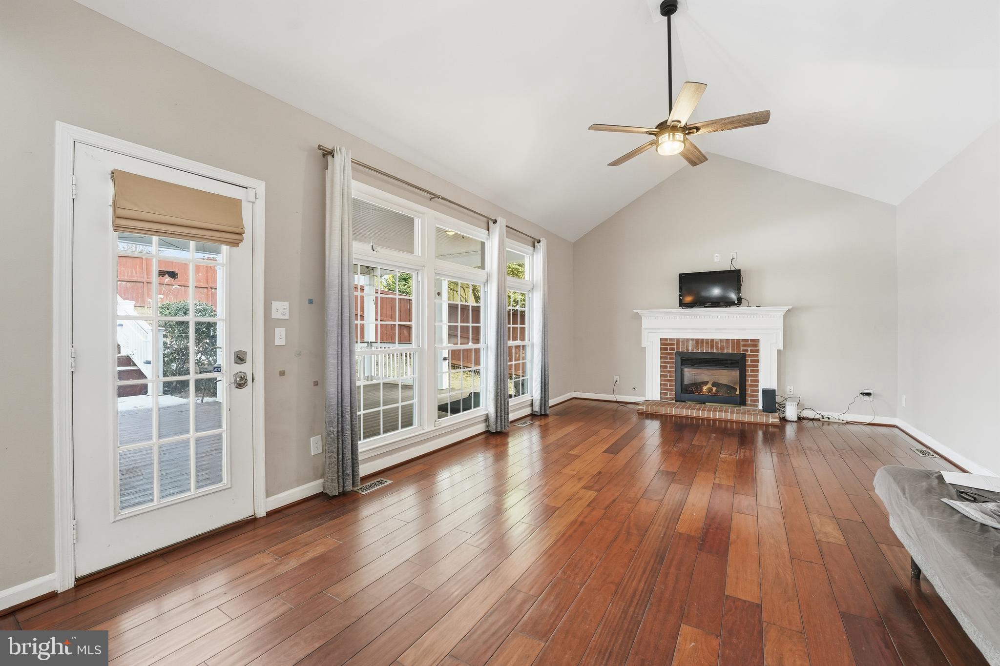 3582 Lions Field Road Triangle, VA 22172 - Photo 25 of 66 a view of empty room with wooden floor and fireplace
