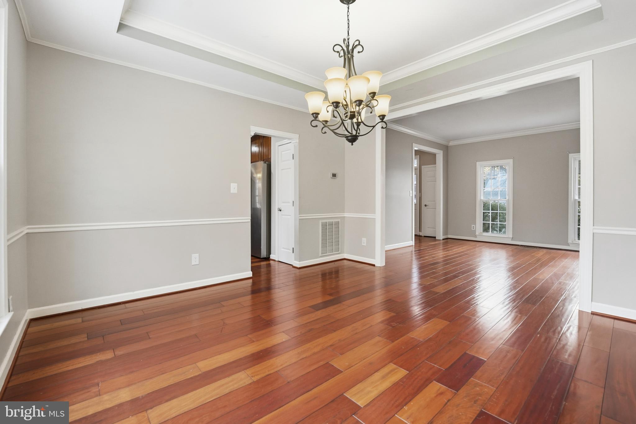 3582 Lions Field Road Triangle, VA 22172 - Photo 29 of 66 a view of an empty room with wooden floor and a window
