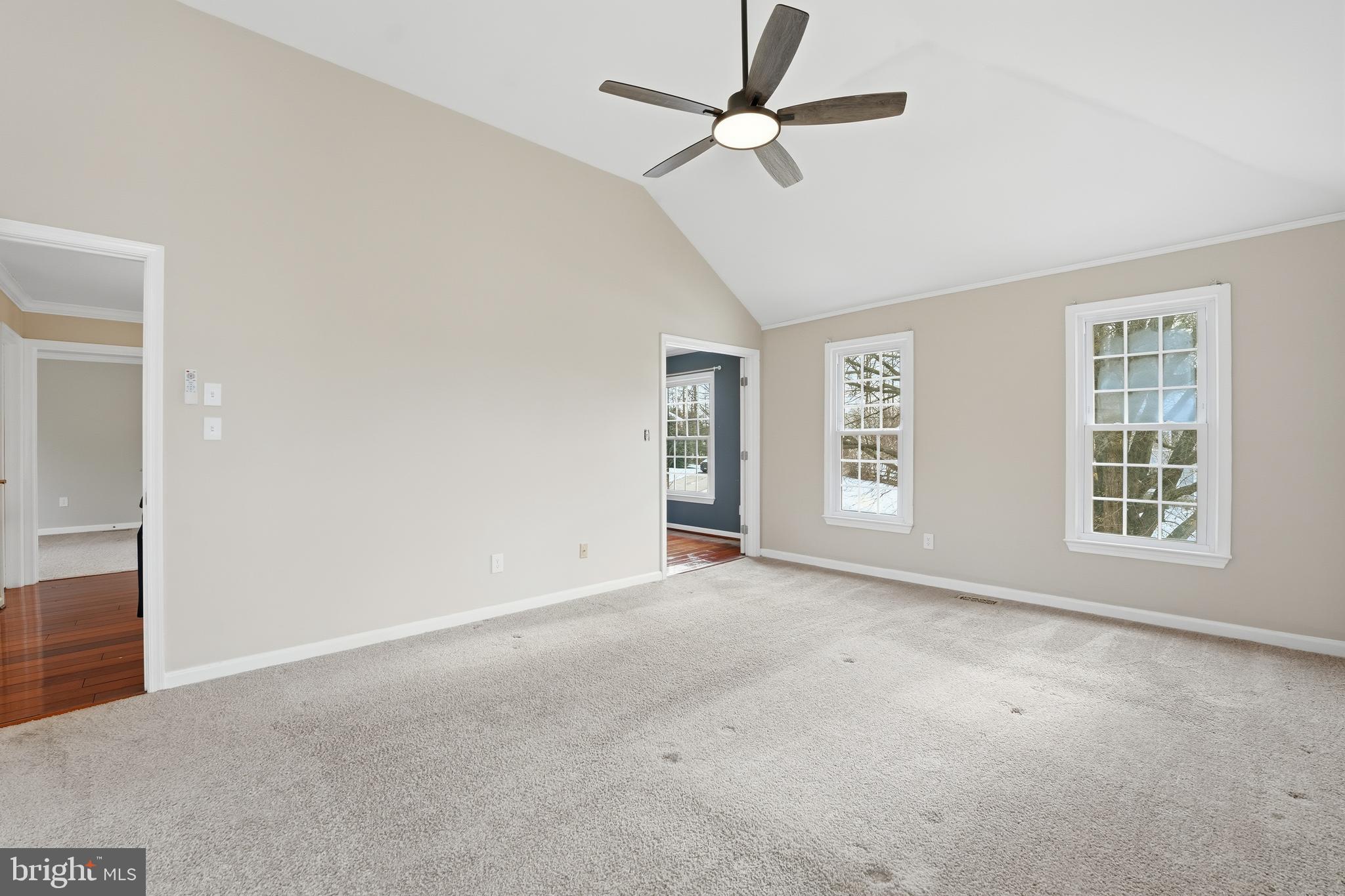 3582 Lions Field Road Triangle, VA 22172 - Photo 33 of 66 an empty room with chandelier fan and windows