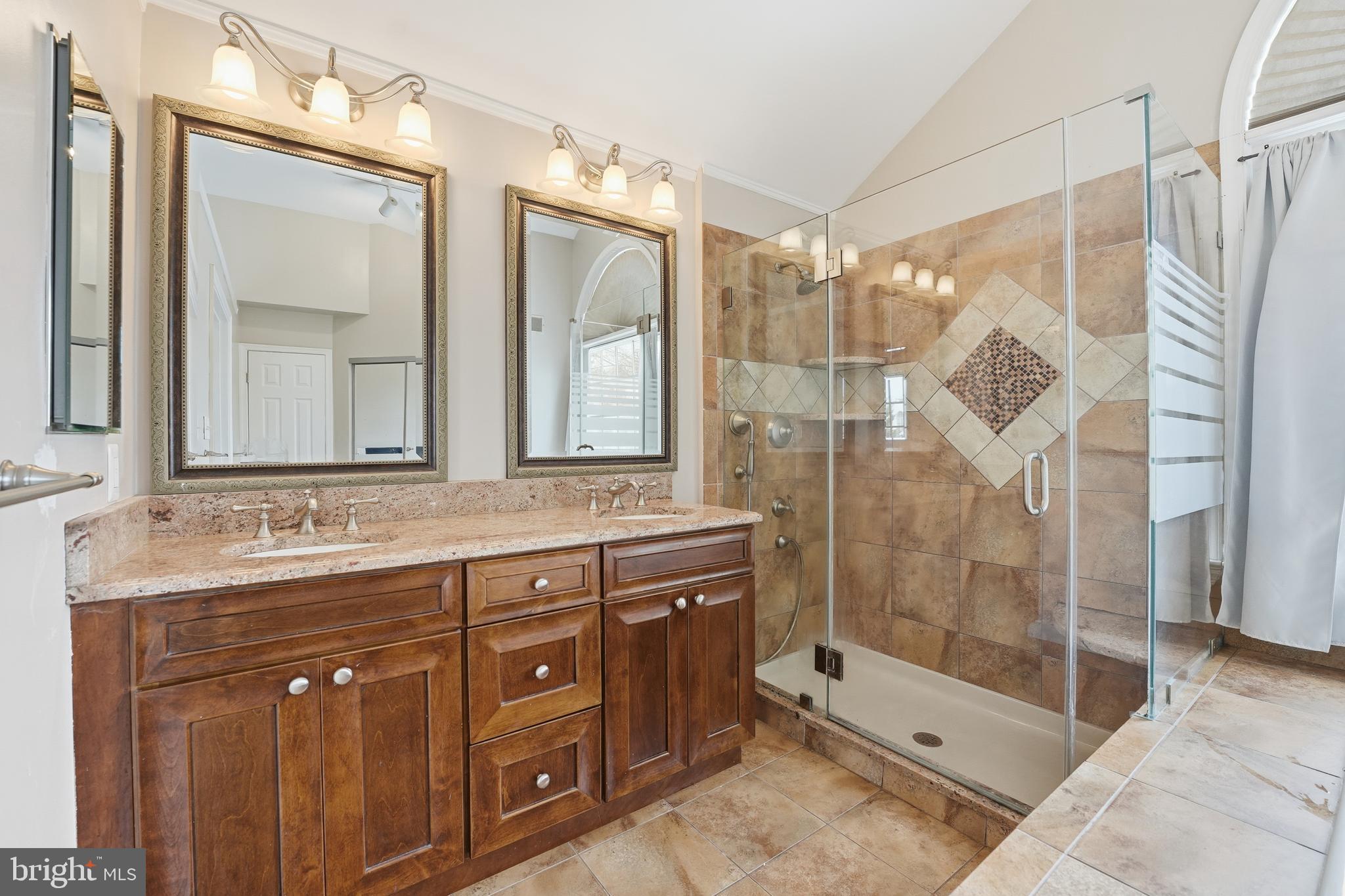 3582 Lions Field Road Triangle, VA 22172 - Photo 34 of 66 a bathroom with a double vanity sink mirror and shower