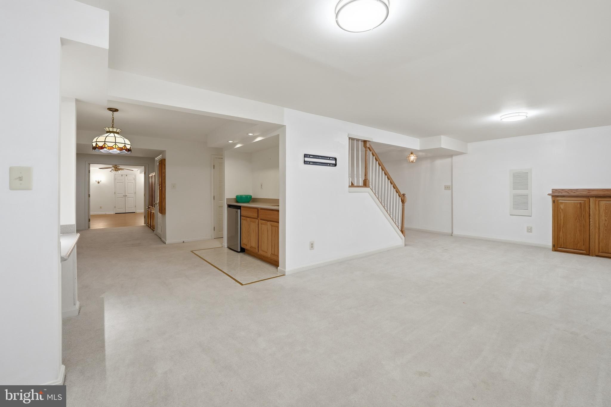 3582 Lions Field Road Triangle, VA 22172 - Photo 46 of 66 a view of a big room with entryway and chandelier