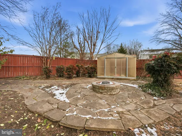 a kitchen with stainless steel appliances granite countertop a kitchen island a stove and a wooden floors