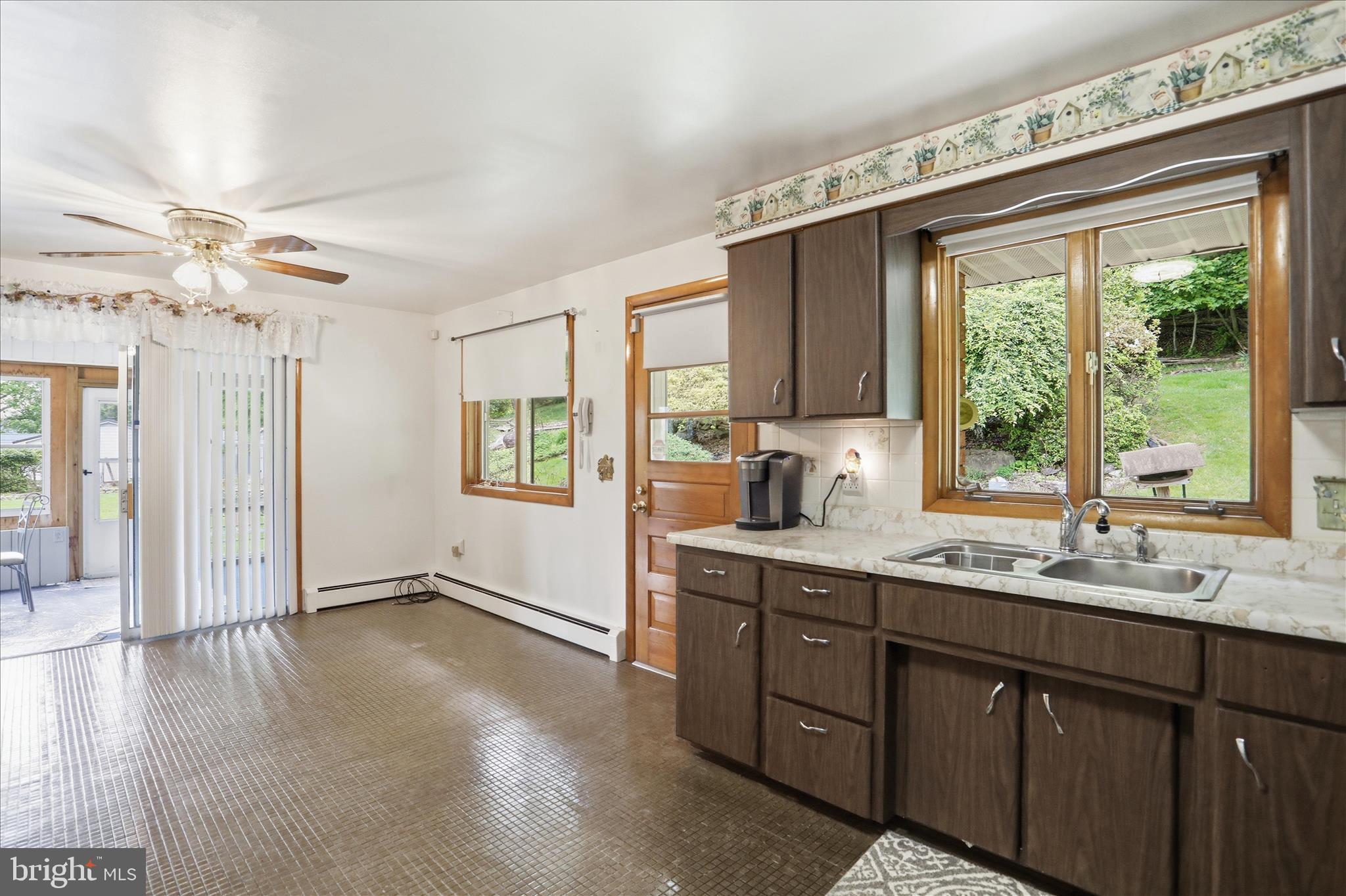 199 Buser Street Ridgeley, WV 26753 - Photo 12 of 49 a kitchen with a sink window and cabinets