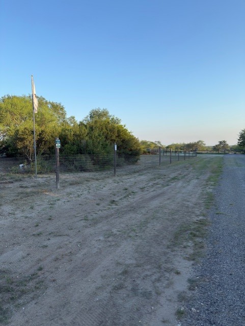 211 County Road 229 Three Rivers, TX 78071 - Photo 3 of 18 a view of a dry yard with trees