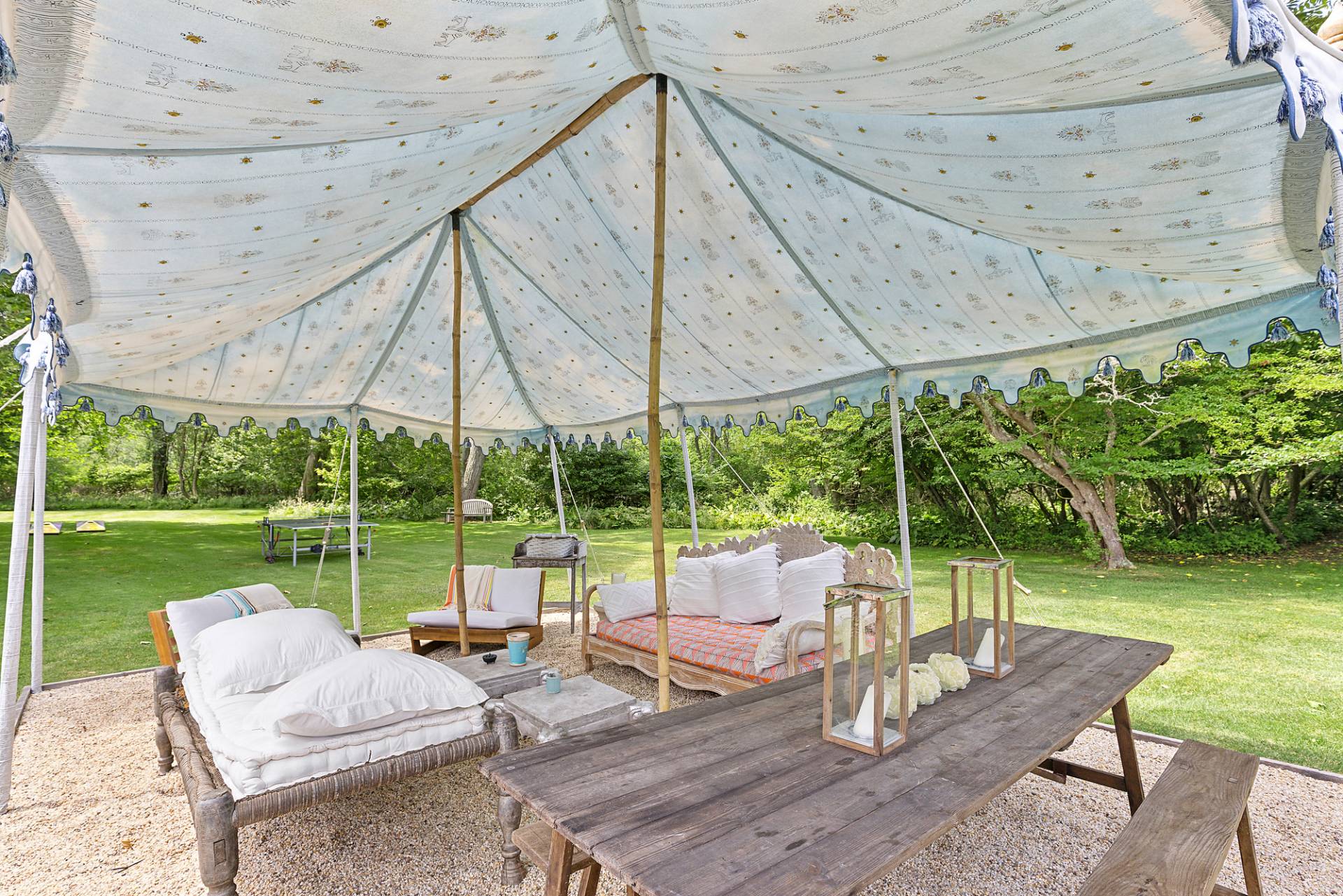 93 Egypt Lane East Hampton, NY 11937 - Photo 11 of 50 a view of a patio with a table chairs and a backyard
