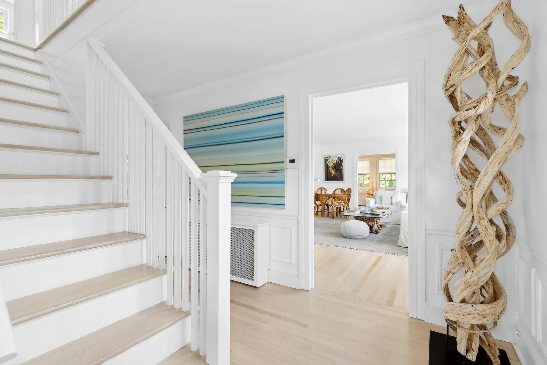 93 Egypt Lane East Hampton, NY 11937 - Photo 17 of 50 a view of a livingroom with wooden floor and white walls