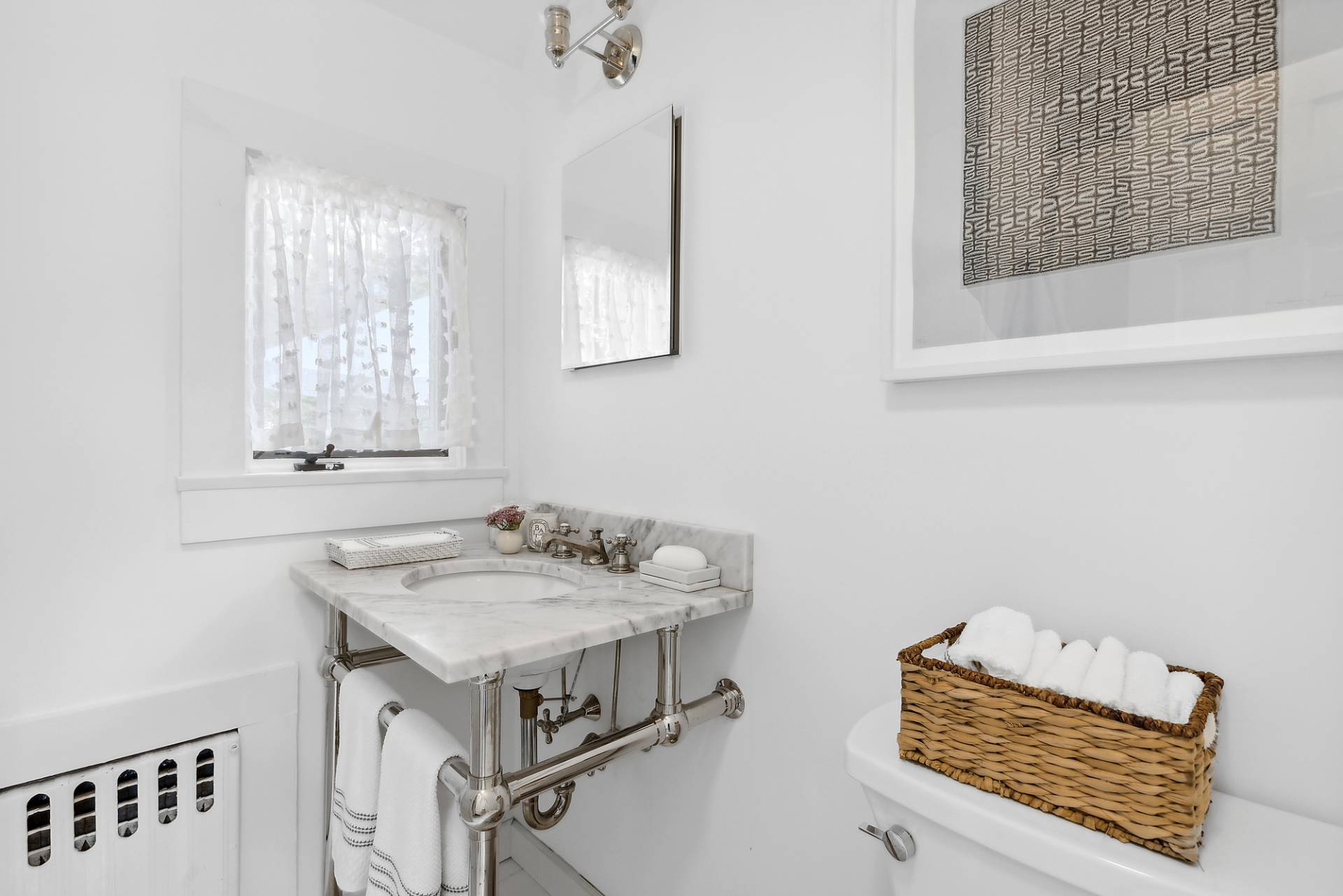 93 Egypt Lane East Hampton, NY 11937 - Photo 28 of 50 a bathroom with a sink and a window