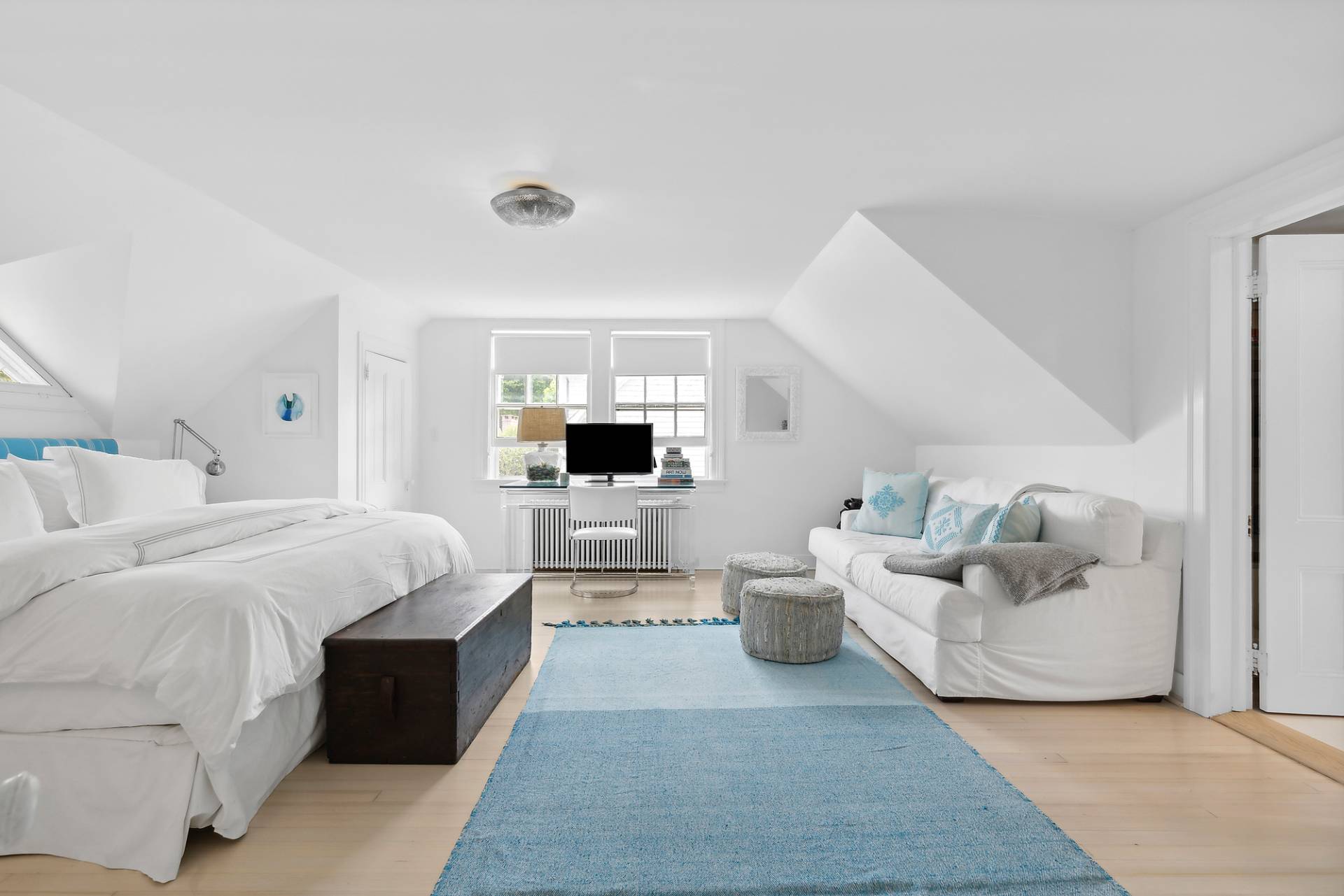 93 Egypt Lane East Hampton, NY 11937 - Photo 30 of 50 a bed room with a bed and a couch