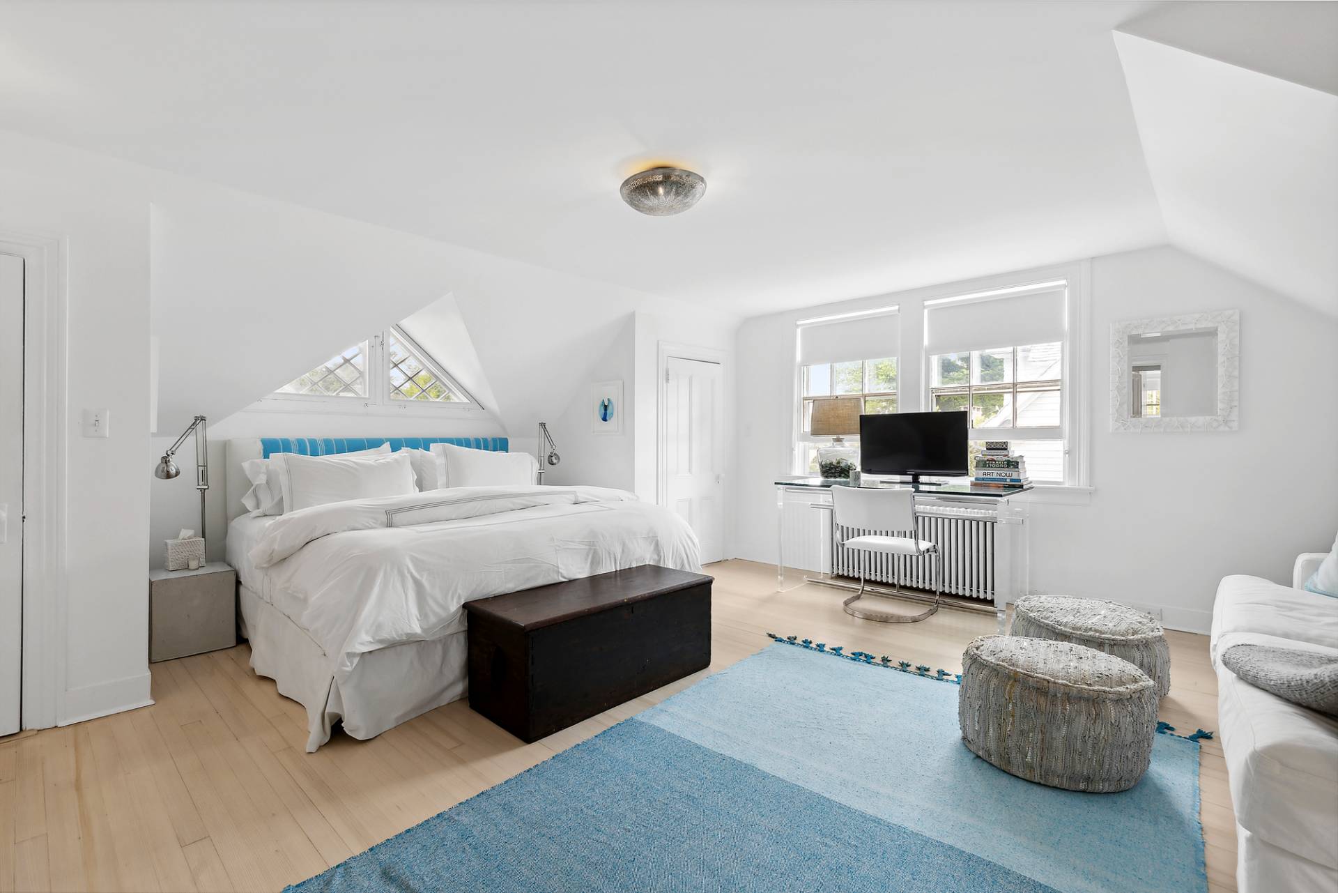 93 Egypt Lane East Hampton, NY 11937 - Photo 31 of 50 a bedroom with a bed and a television