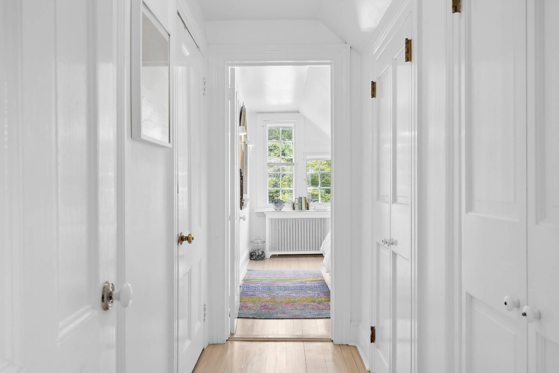 93 Egypt Lane East Hampton, NY 11937 - Photo 39 of 50 a view of a hallway with windows