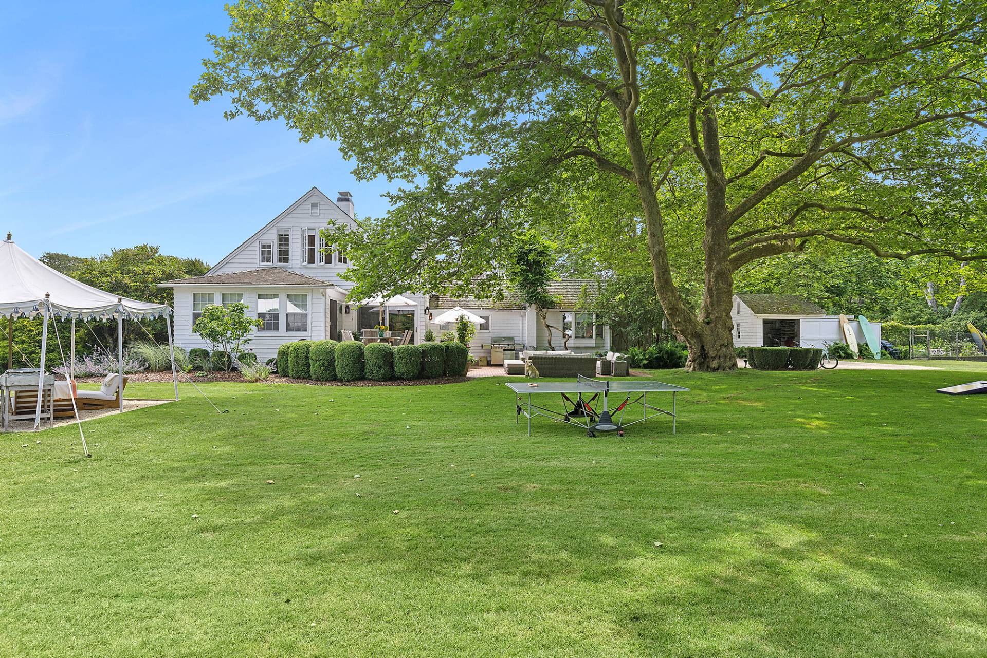 93 Egypt Lane East Hampton, NY 11937 - Photo 5 of 50 a view of a house with a yard porch and sitting area