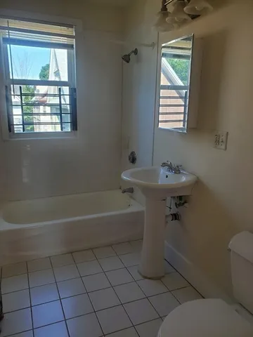 a bathroom with a sink toilet and a bathtub