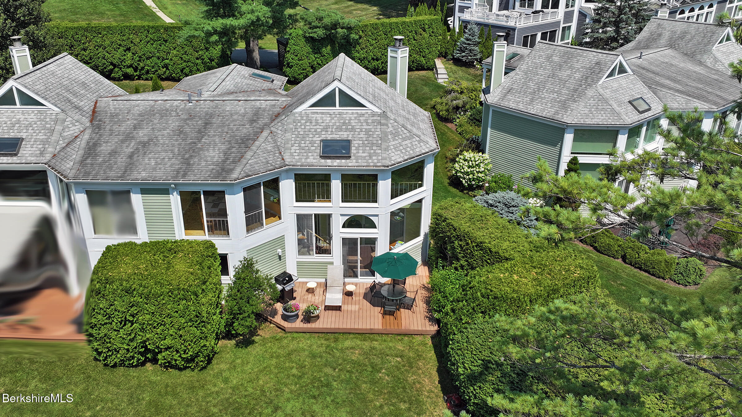 19 Hawthorne Road, Unit GH 4 Stockbridge, MA 01262 - Photo 1 of 46 a front view of a house with a garden and plants