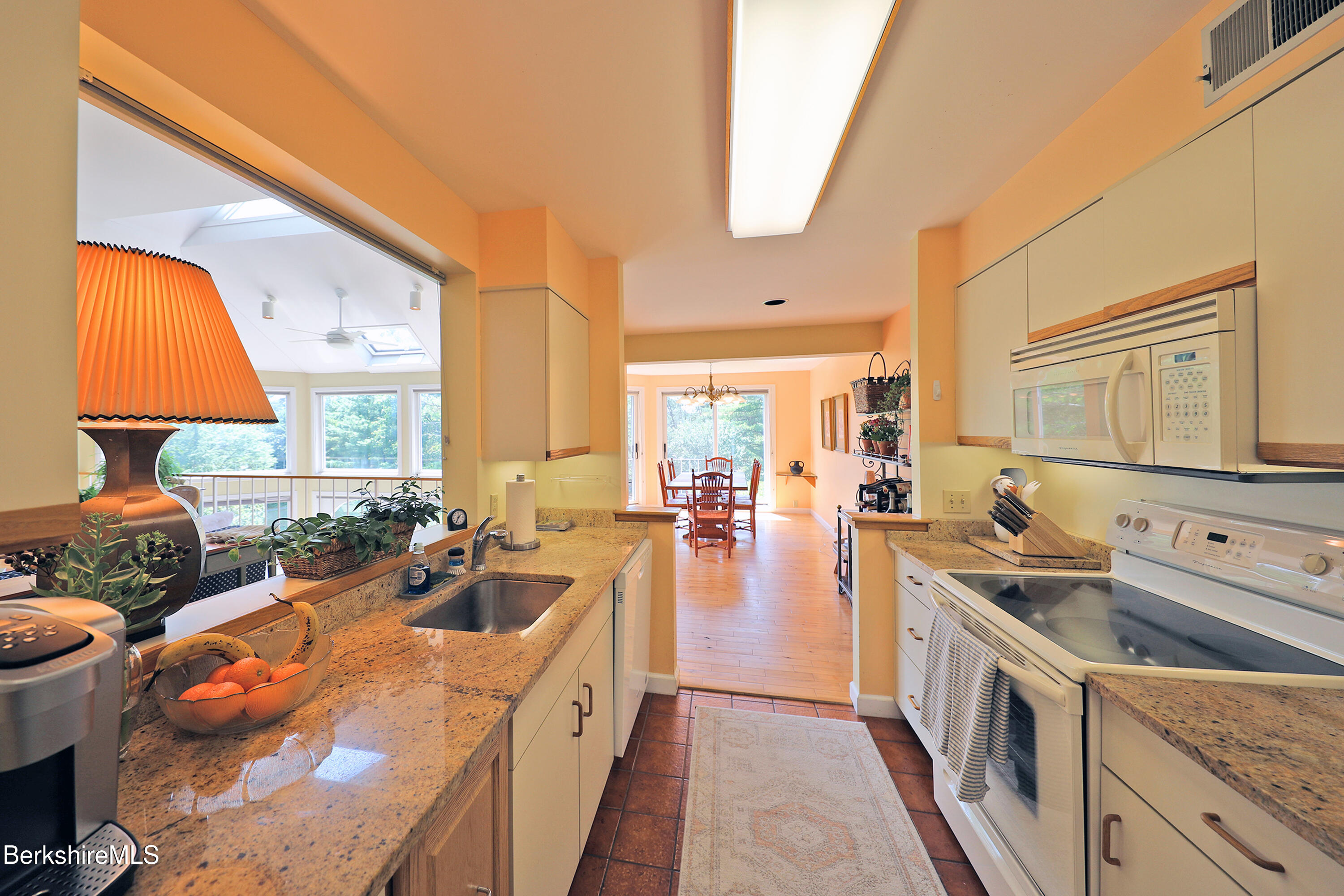 19 Hawthorne Road, Unit GH 4 Stockbridge, MA 01262 - Photo 12 of 46 a open kitchen with stainless steel appliances granite countertop a lot of living room stove a sink and dishwasher with wooden floor