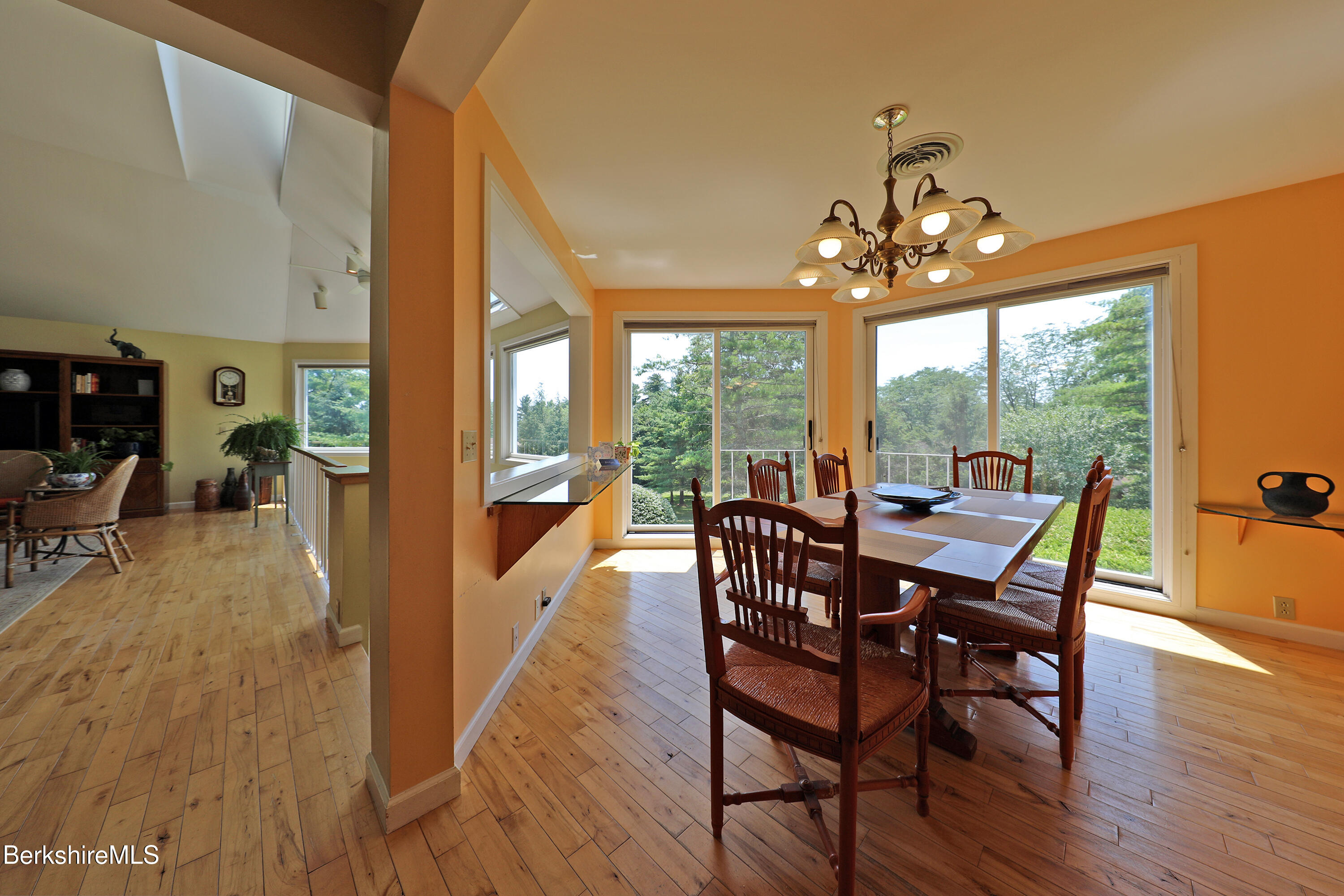 19 Hawthorne Road, Unit GH 4 Stockbridge, MA 01262 - Photo 16 of 46 a view of a dining room with furniture a chandelier and wooden floor
