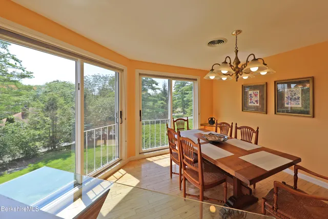 a view of a dining room with furniture window and outside view