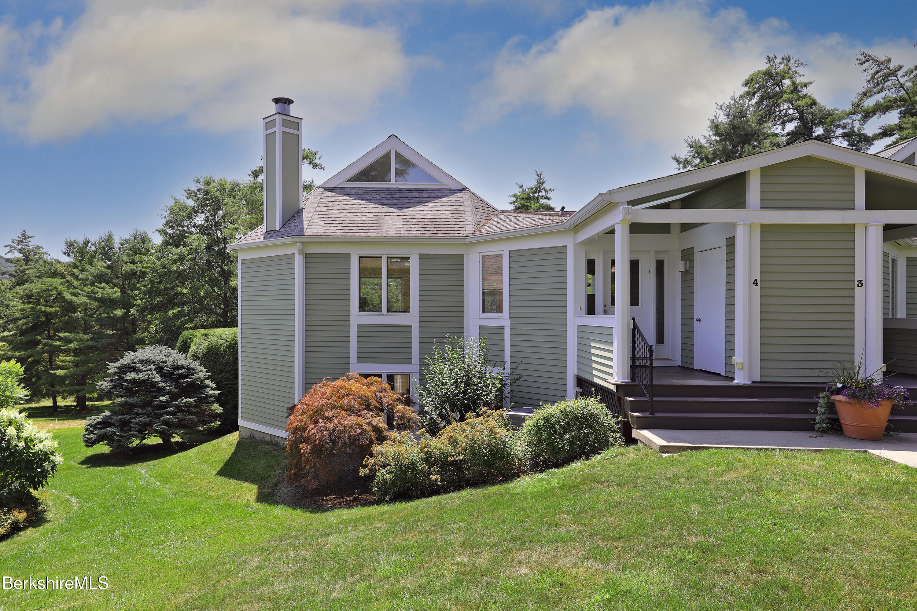 19 Hawthorne Road, Unit GH 4 Stockbridge, MA 01262 - Photo 2 of 46 a front view of a house with garden