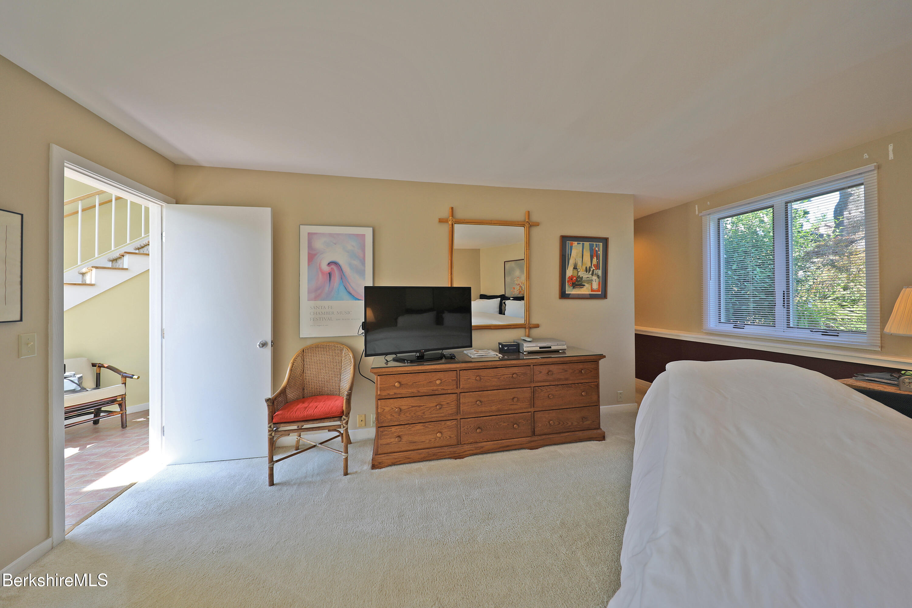 19 Hawthorne Road, Unit GH 4 Stockbridge, MA 01262 - Photo 25 of 46 a room with furniture a flat screen tv and a window