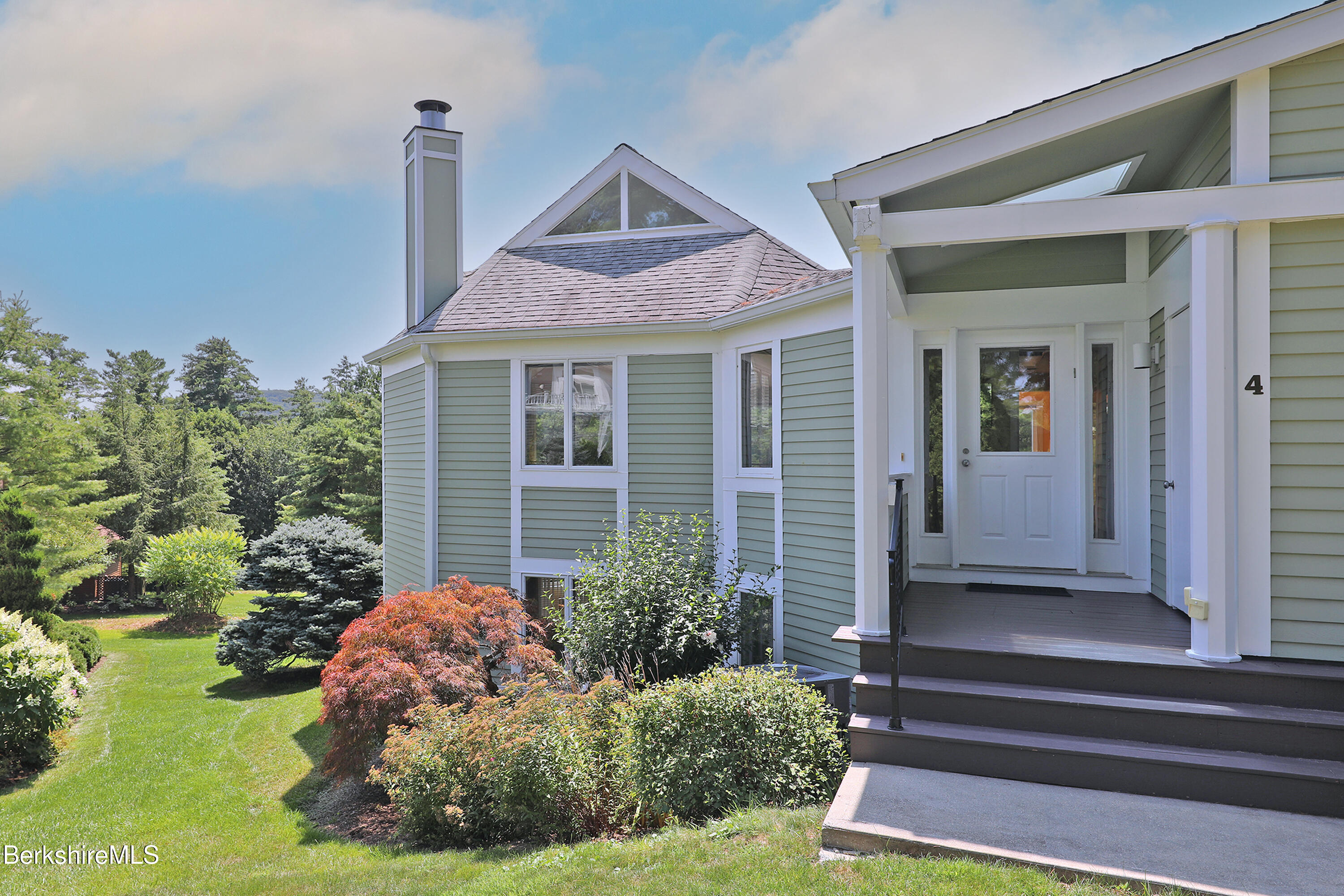 19 Hawthorne Road, Unit GH 4 Stockbridge, MA 01262 - Photo 3 of 46 a front view of a house with garden