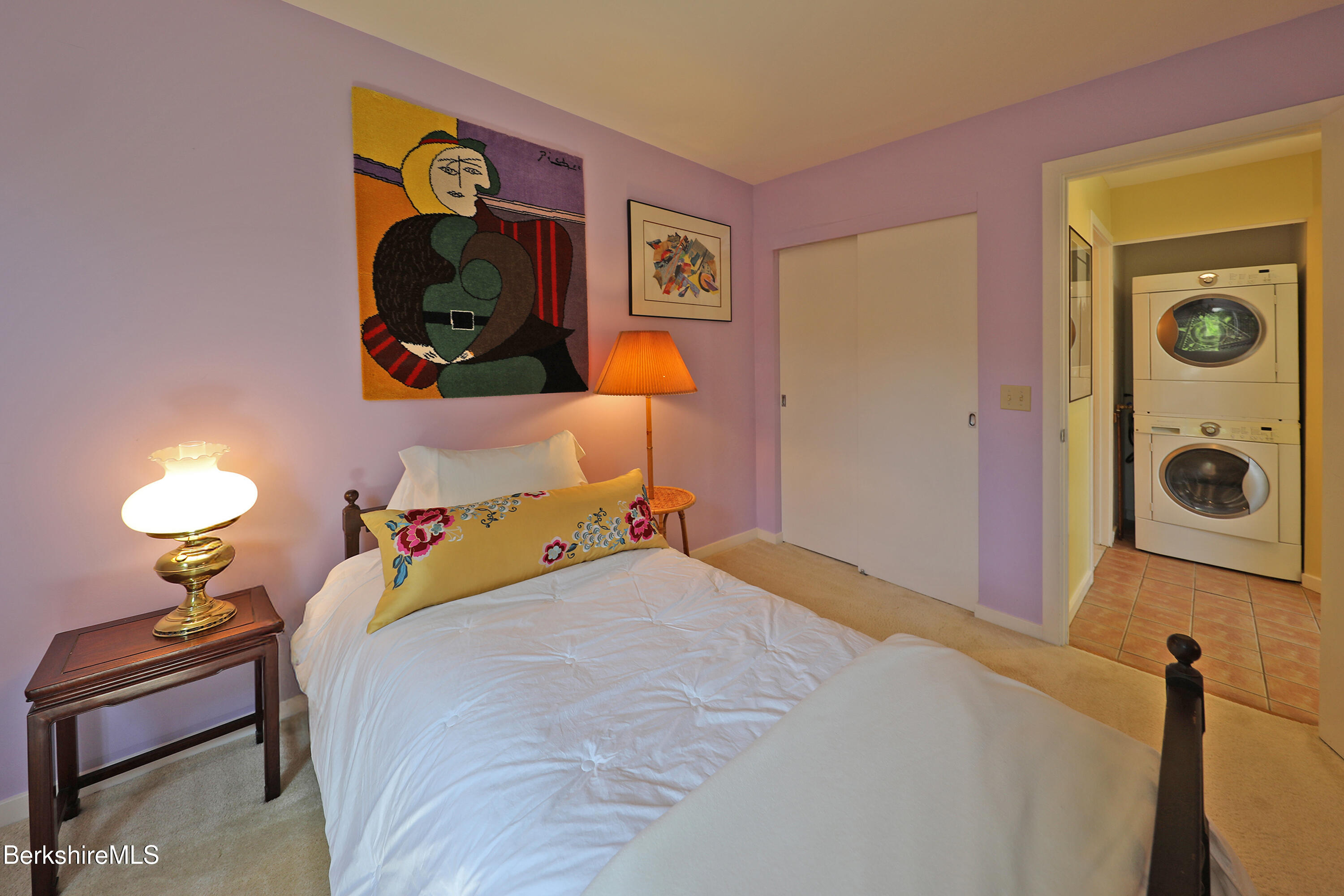 19 Hawthorne Road, Unit GH 4 Stockbridge, MA 01262 - Photo 35 of 46 a bedroom with a bed and a chandelier