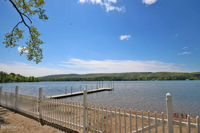 a view of yard with swimming pool and trees