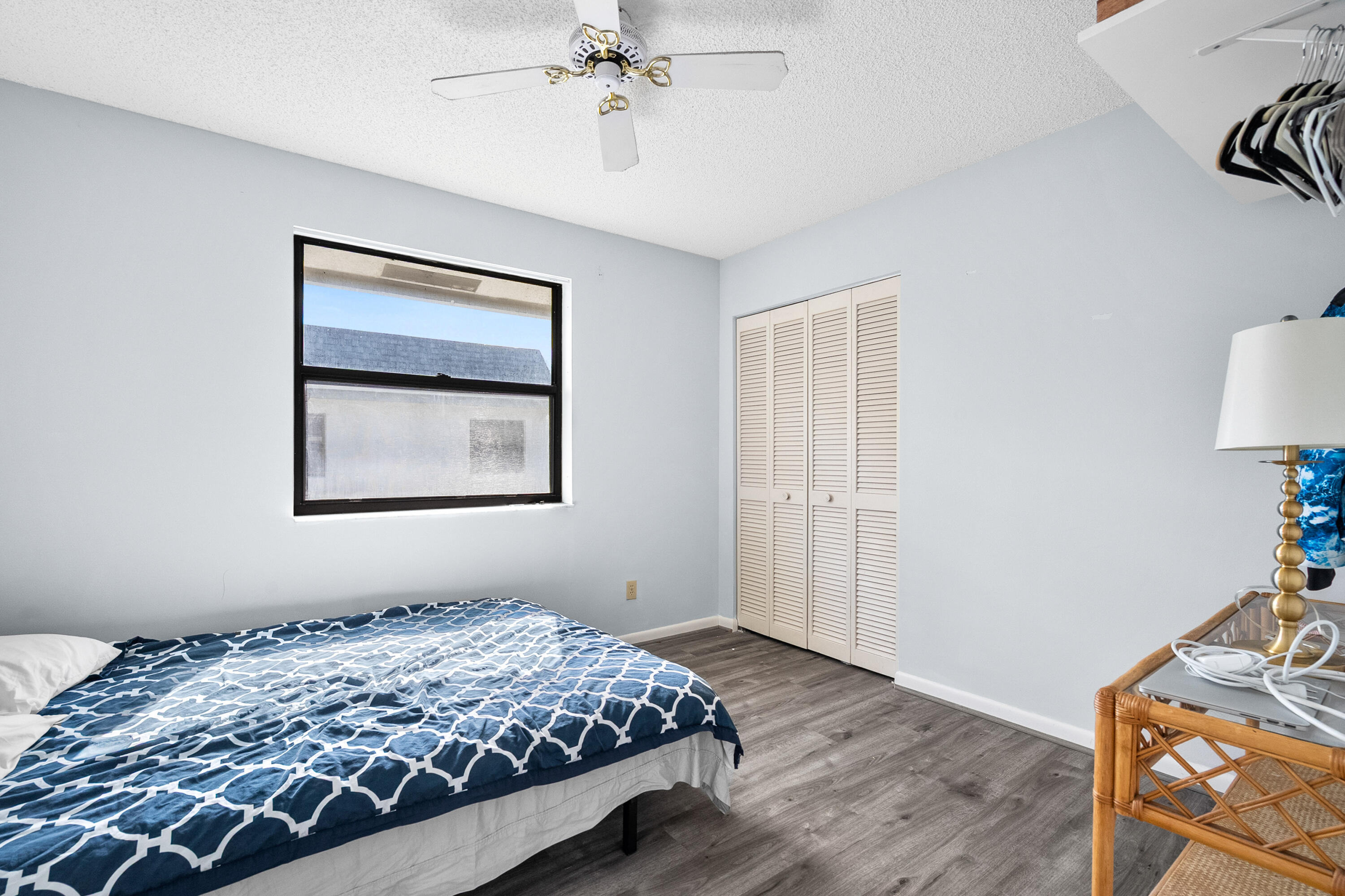 1250 Southeast Parkview Place, Unit C10 Stuart, FL 34994 - Photo 15 of 19 a bedroom with bed and window