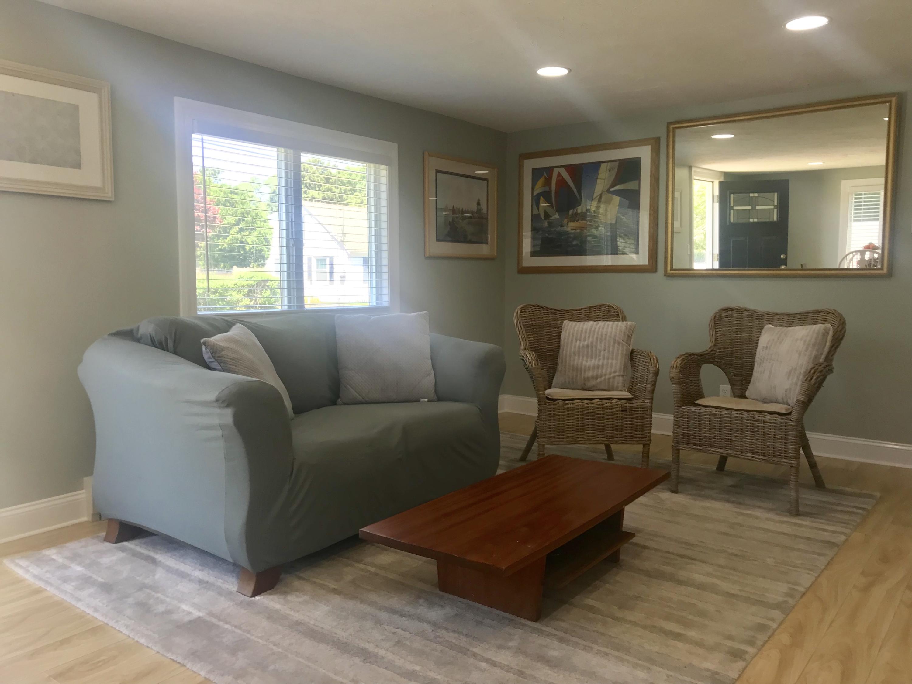 162 Spring Street Hyannis, MA 02601 - Photo 15 of 30 a living room with furniture and a window