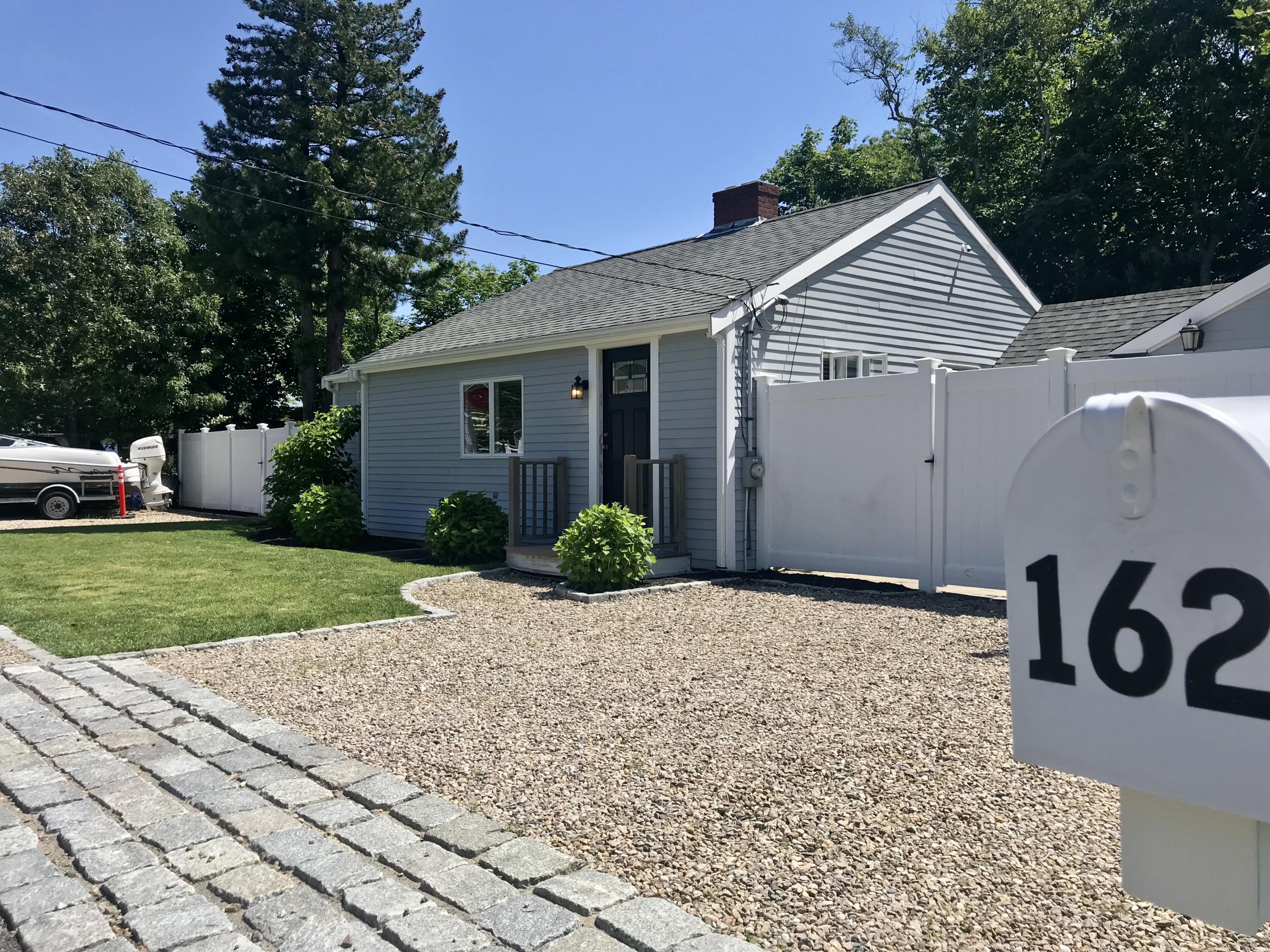 162 Spring Street Hyannis, MA 02601 - Photo 28 of 30 a front view of a house with garden