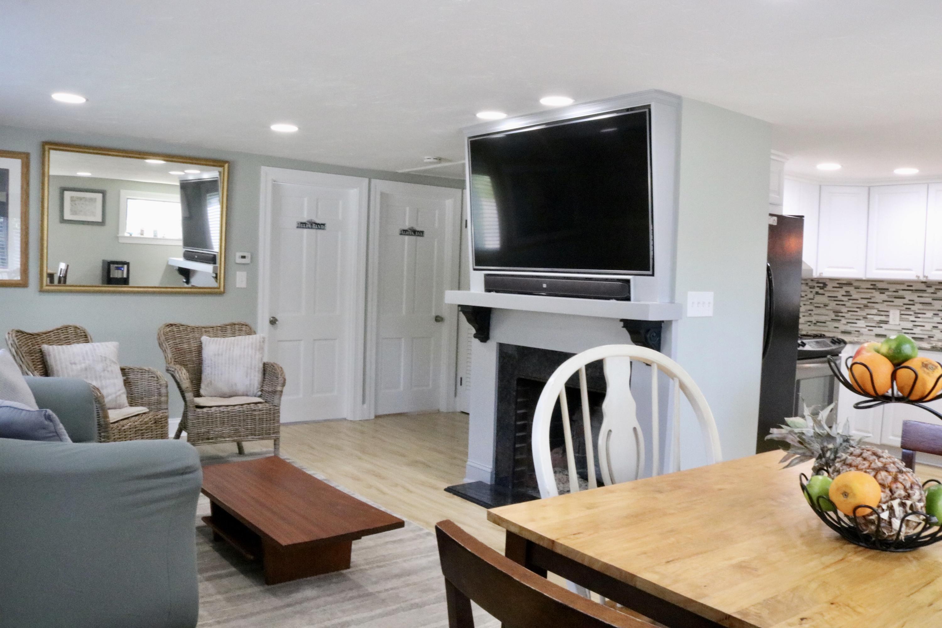 162 Spring Street Hyannis, MA 02601 - Photo 9 of 30 a living room with furniture and a flat screen tv