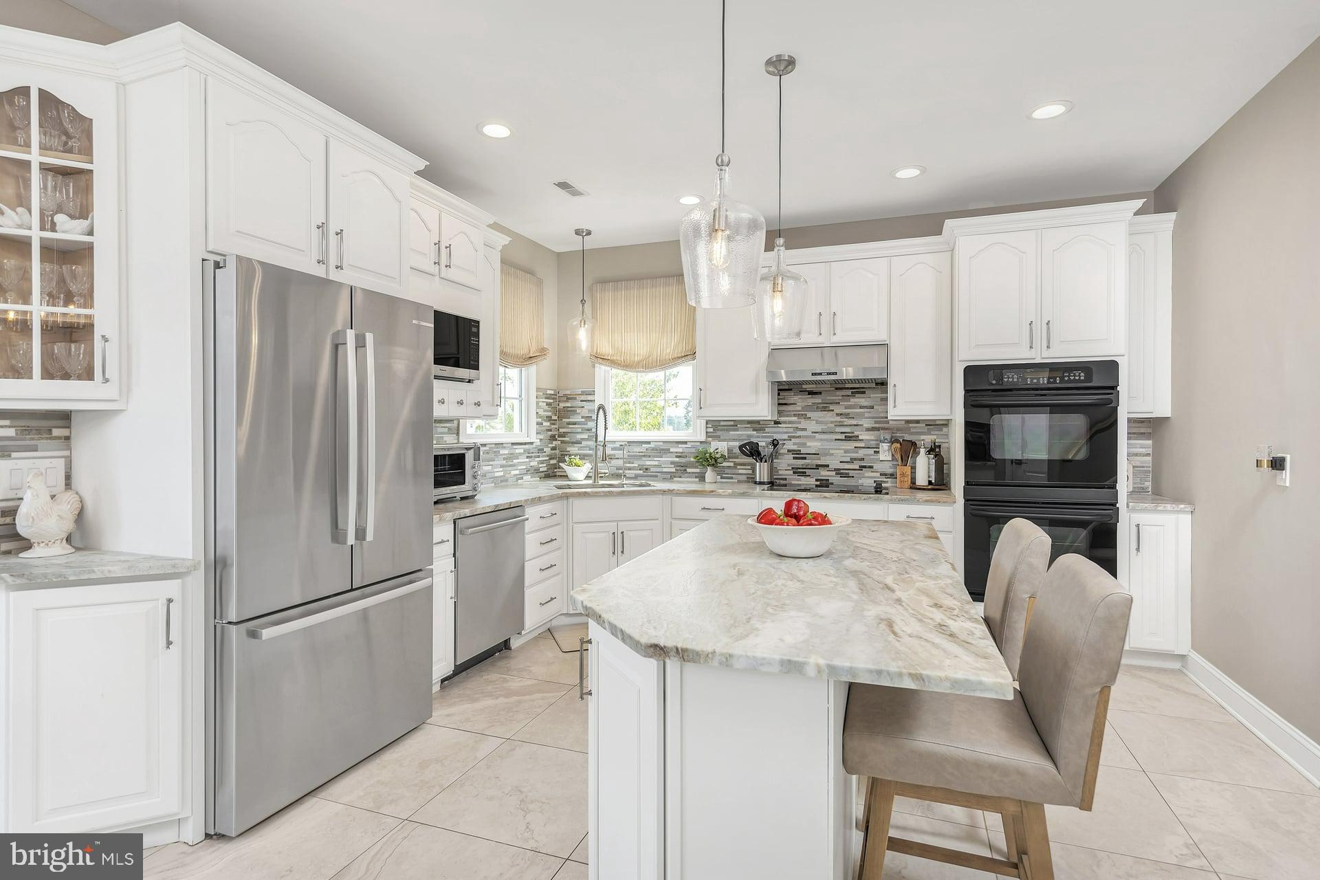 221 Point Airy Road Pilesgrove, NJ 08098 - Photo 12 of 34 a kitchen with stainless steel appliances granite countertop a refrigerator a stove a sink and a refrigerator