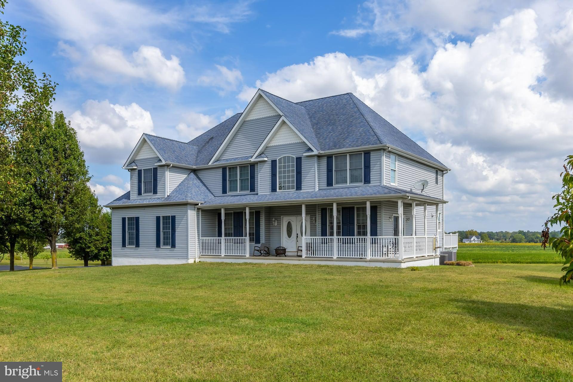 221 Point Airy Road Pilesgrove, NJ 08098 - Photo 2 of 34 a front view of a house with a garden