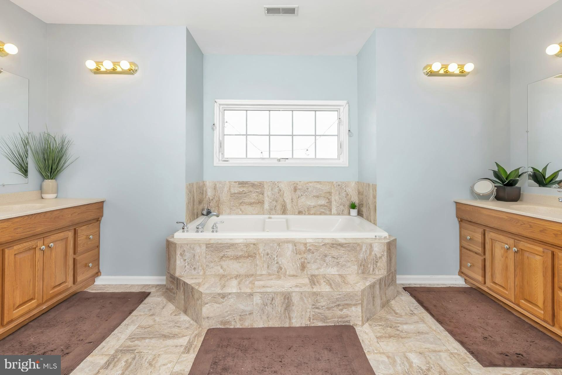 221 Point Airy Road Pilesgrove, NJ 08098 - Photo 25 of 34 a spacious bathroom with a granite countertop sink a mirror and a bathtub