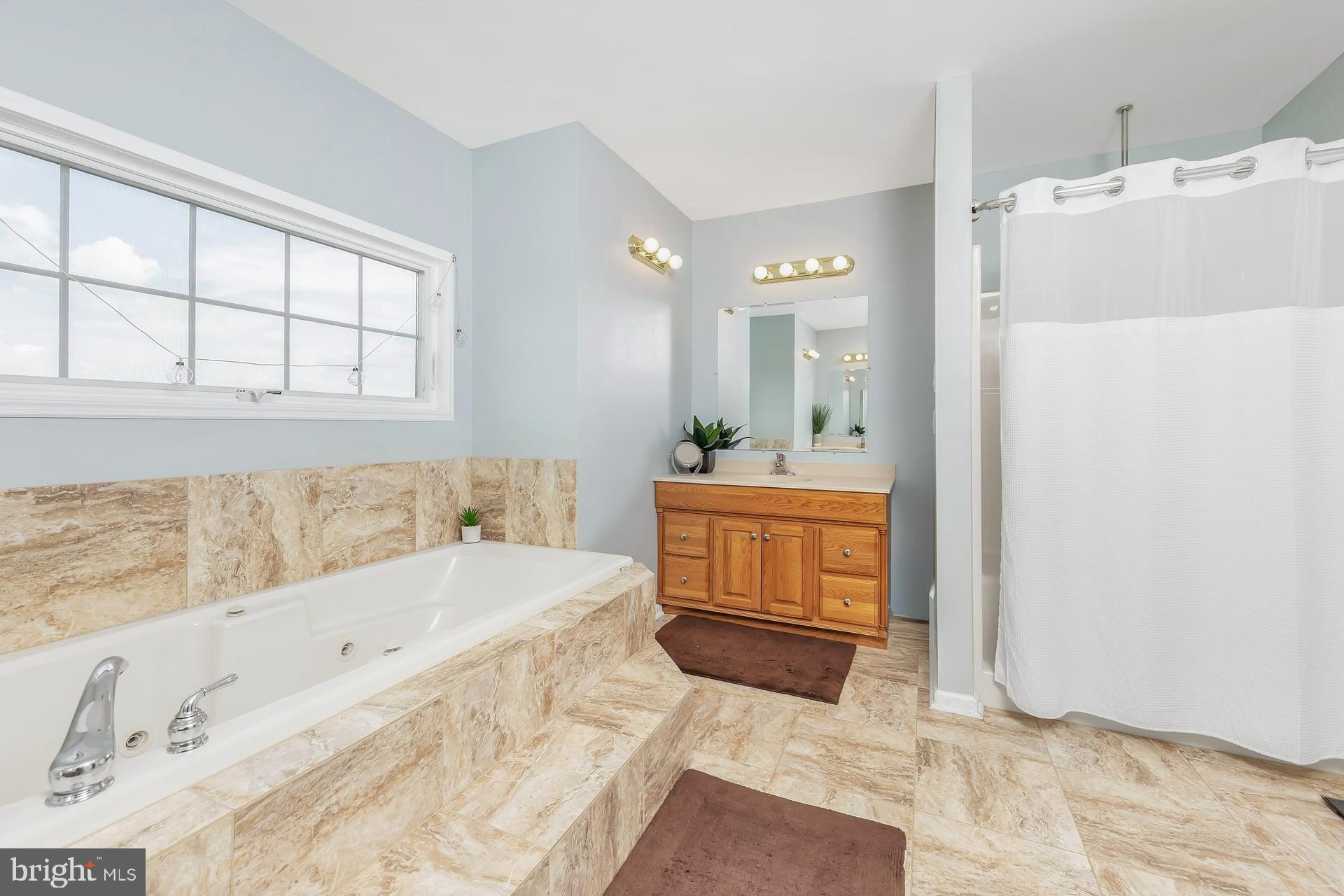 221 Point Airy Road Pilesgrove, NJ 08098 - Photo 26 of 34 a bathroom with a tub sink and mirror
