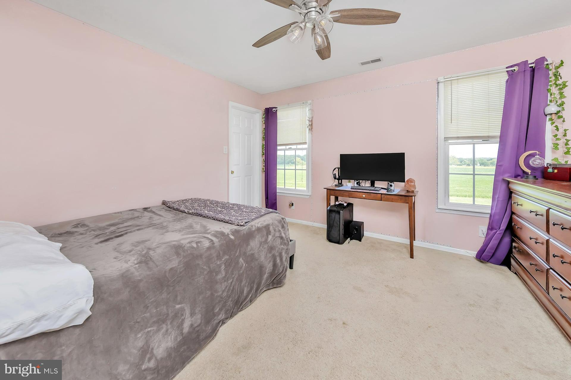 221 Point Airy Road Pilesgrove, NJ 08098 - Photo 27 of 34 a bedroom with a bed and a flat screen tv