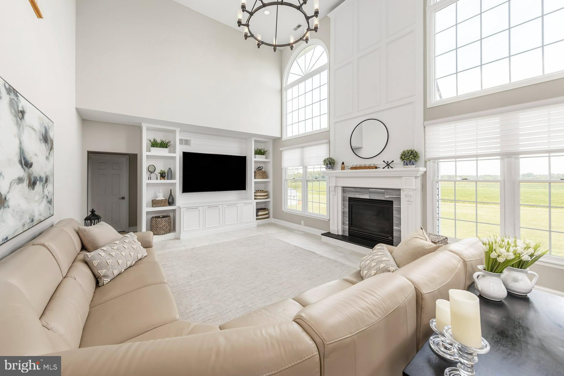 221 Point Airy Road Pilesgrove, NJ 08098 - Photo 5 of 34 a living room with furniture a fireplace and a flat screen tv