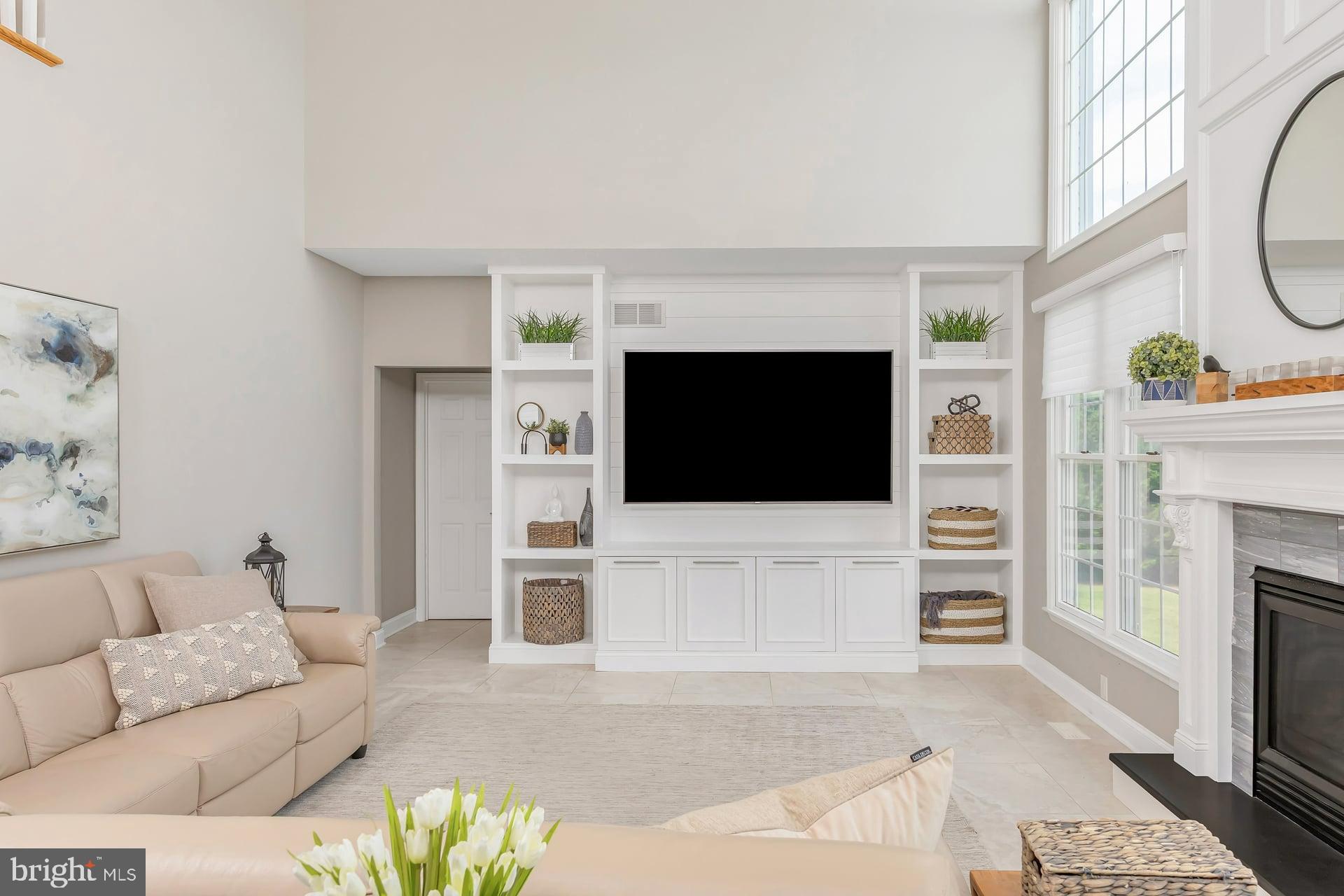 221 Point Airy Road Pilesgrove, NJ 08098 - Photo 6 of 34 a living room with furniture a flat screen tv and a fireplace
