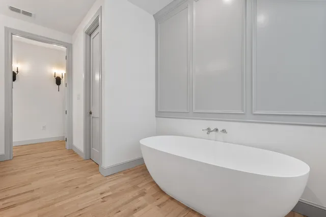 a white bath tub sitting in a bathroom