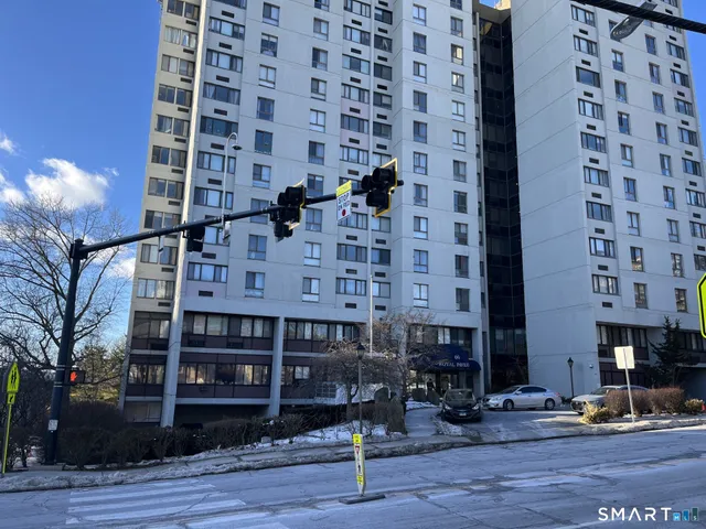 a view of a building with sitting area