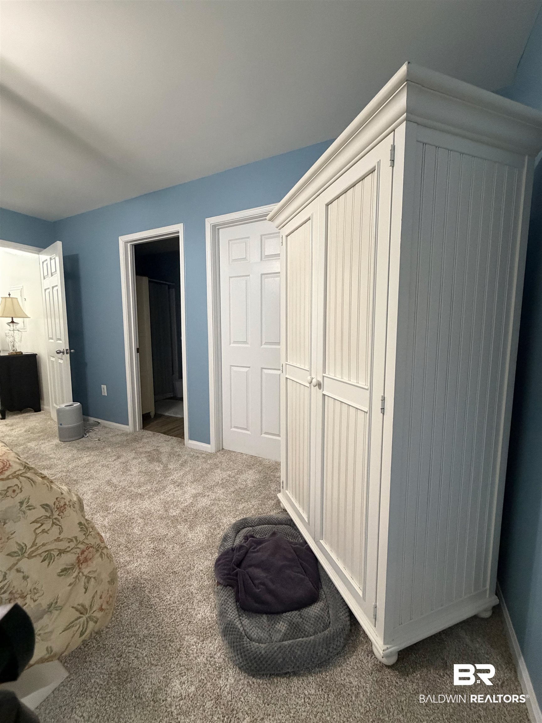 1517 Regency Road, Unit 71 Gulf Shores, AL 36542 - Photo 22 of 26 Bedroom featuring carpet flooring and a closet