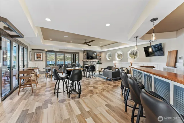 a dining room with furniture and wooden floor
