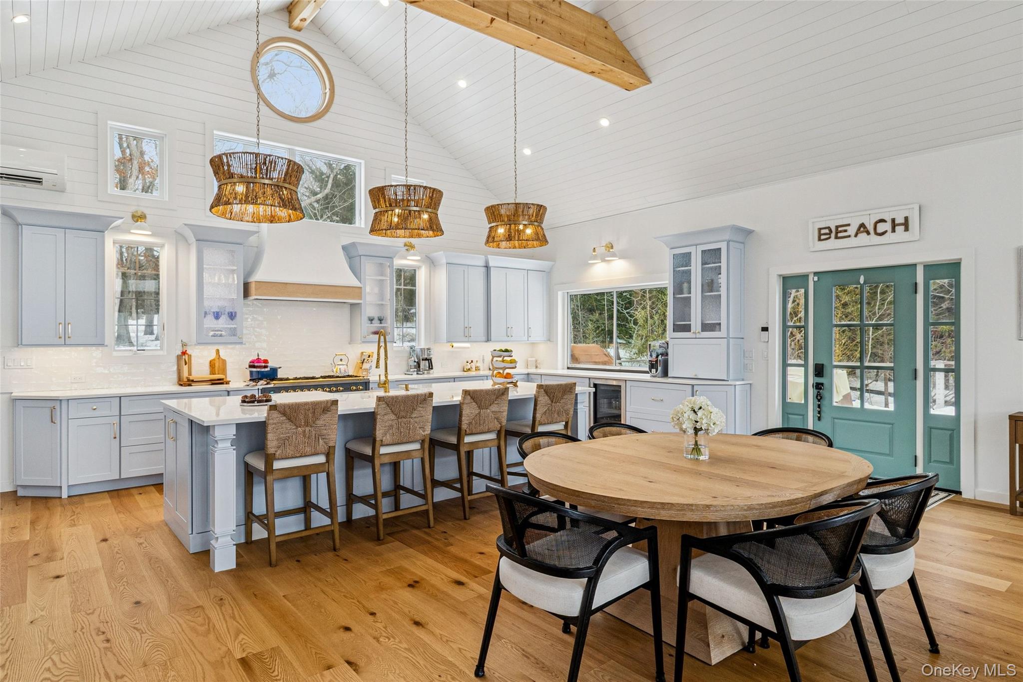 80 Louse Point Road East Hampton, NY 11937 - Photo 6 of 19 a view of a dining room with furniture and chandelier