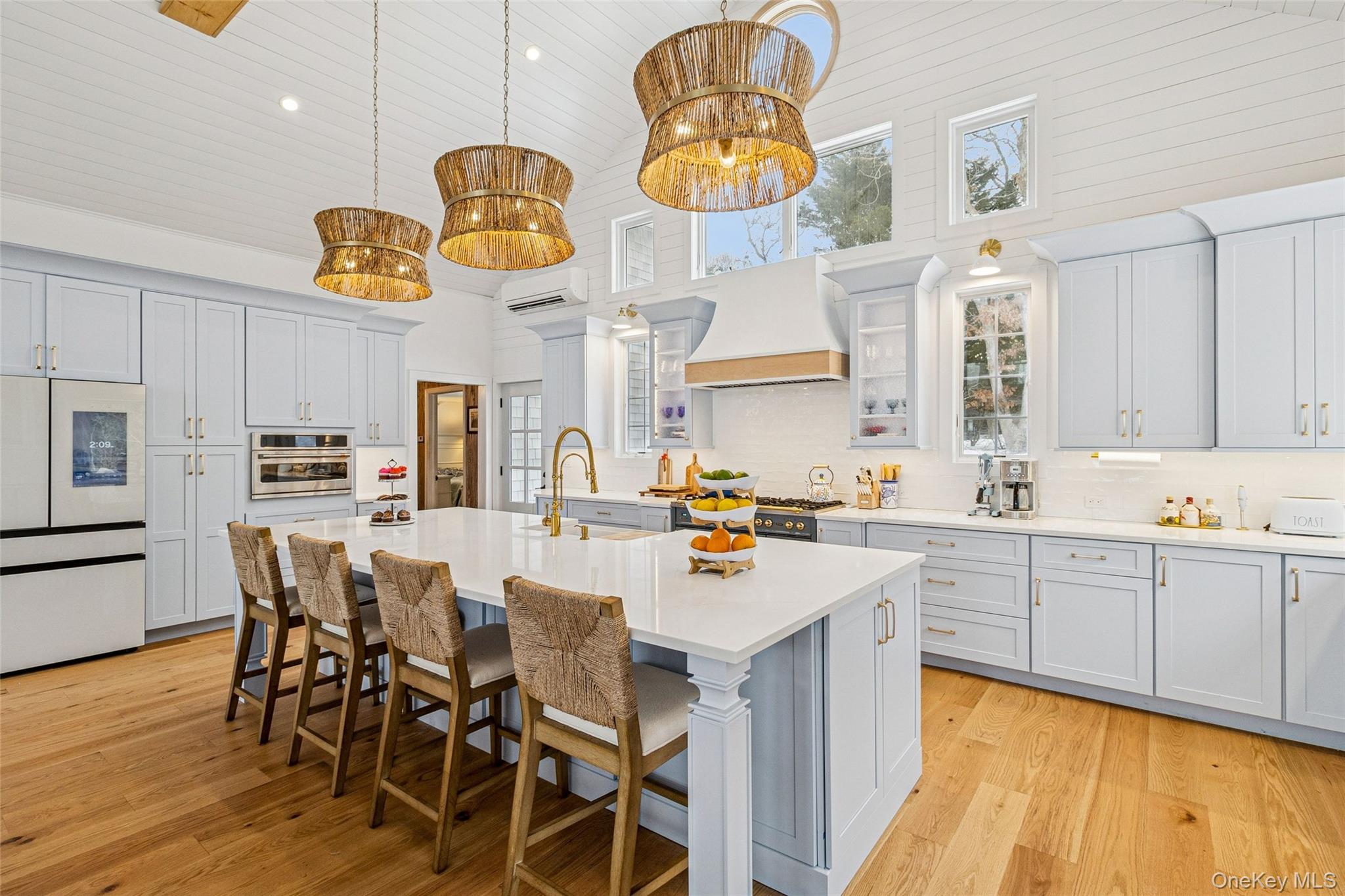 80 Louse Point Road East Hampton, NY 11937 - Photo 7 of 19 a kitchen with cabinets a sink and appliances