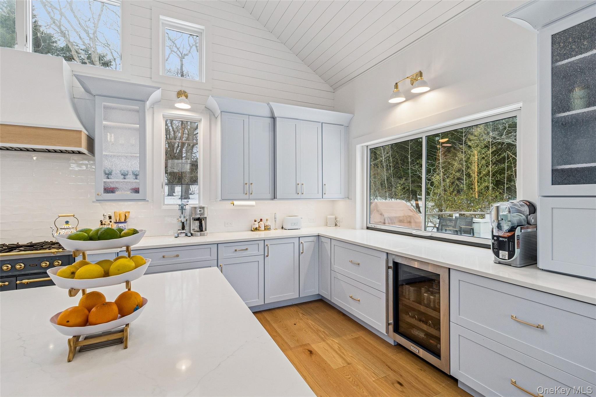 80 Louse Point Road East Hampton, NY 11937 - Photo 8 of 19 a kitchen with a sink cabinets and window