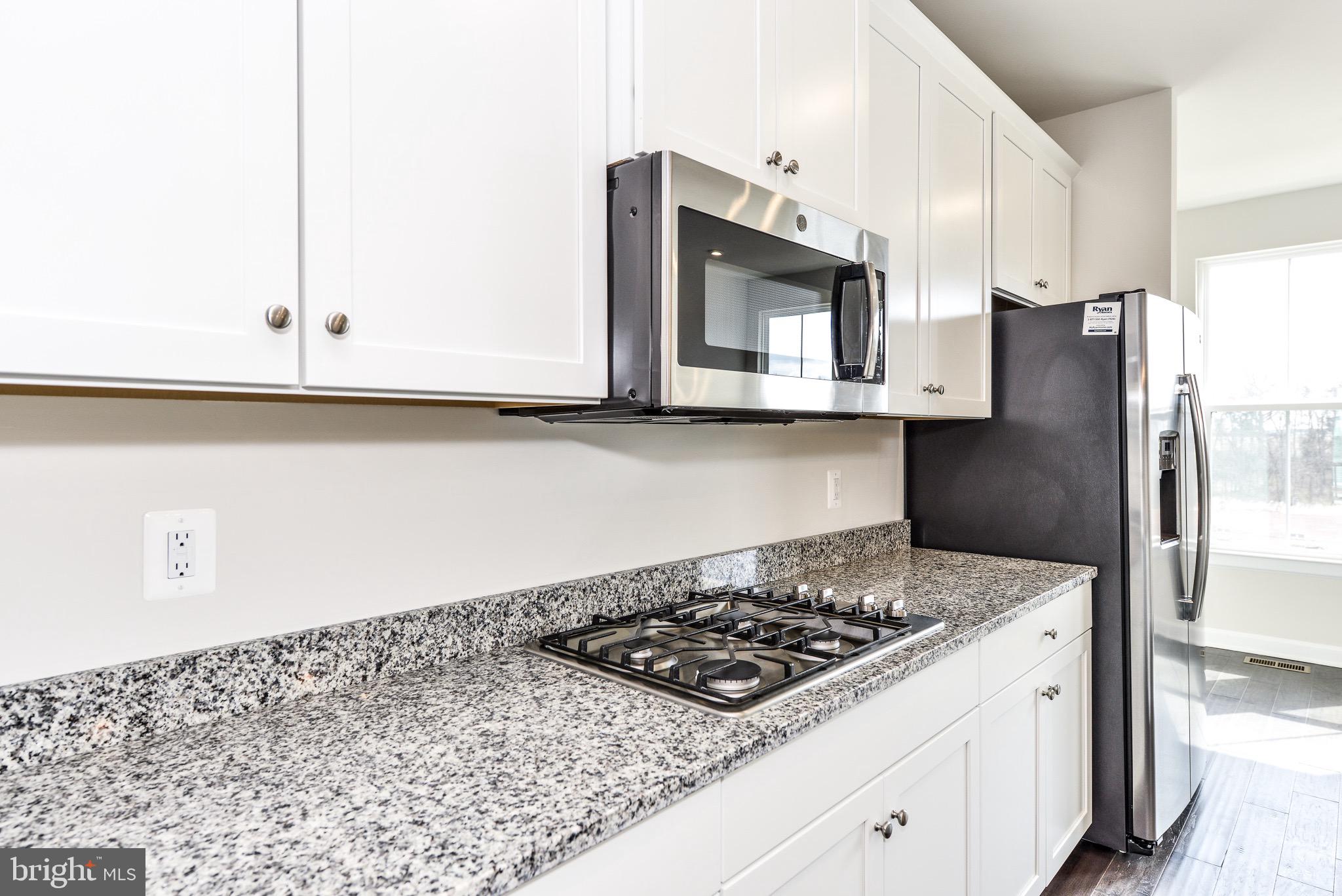 22353 Exe Square Ashburn, VA 20148 - Photo 8 of 38 Stainless appliances and gas cooktop
