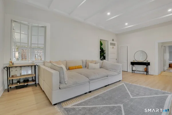 a living room with furniture and a window