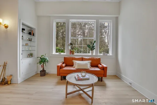 a living room with furniture and a window