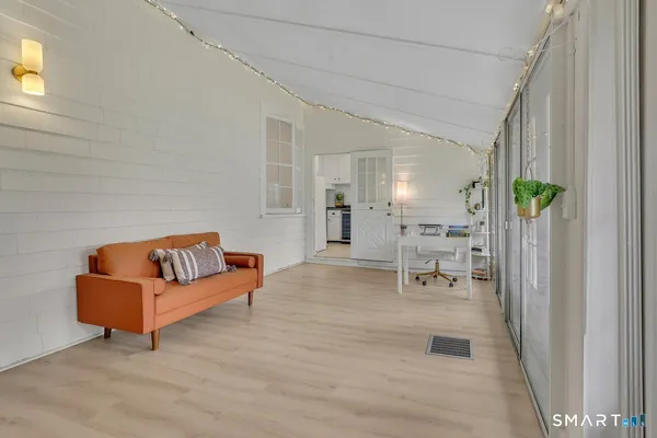 a living room with furniture and a table